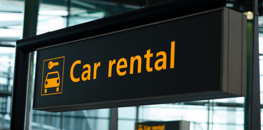 a few of a car rental sign at an airport. This is in relation to car rentals charlottetown PEI